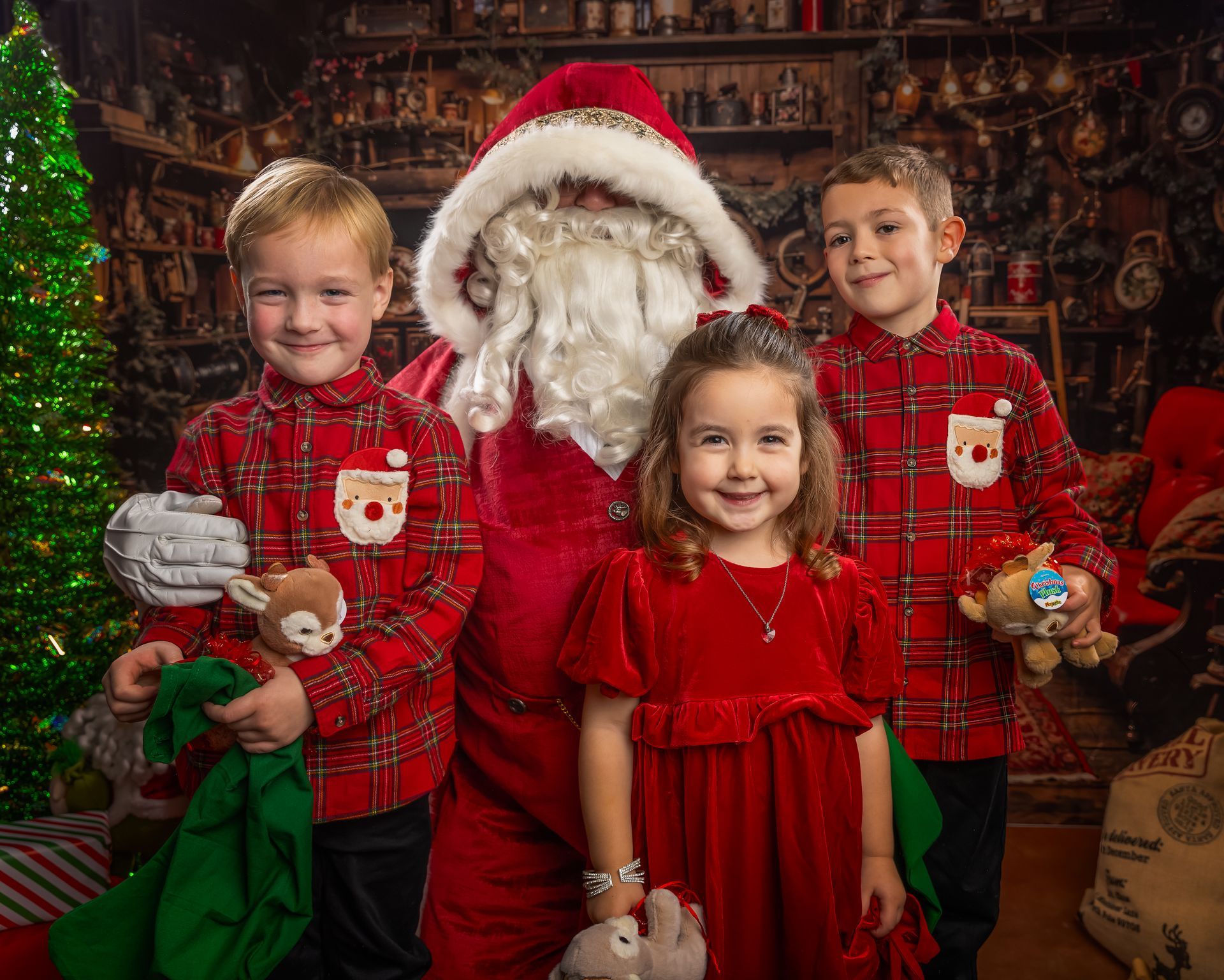 Santa Claus with three children, one holds a cookie. Festive red background.