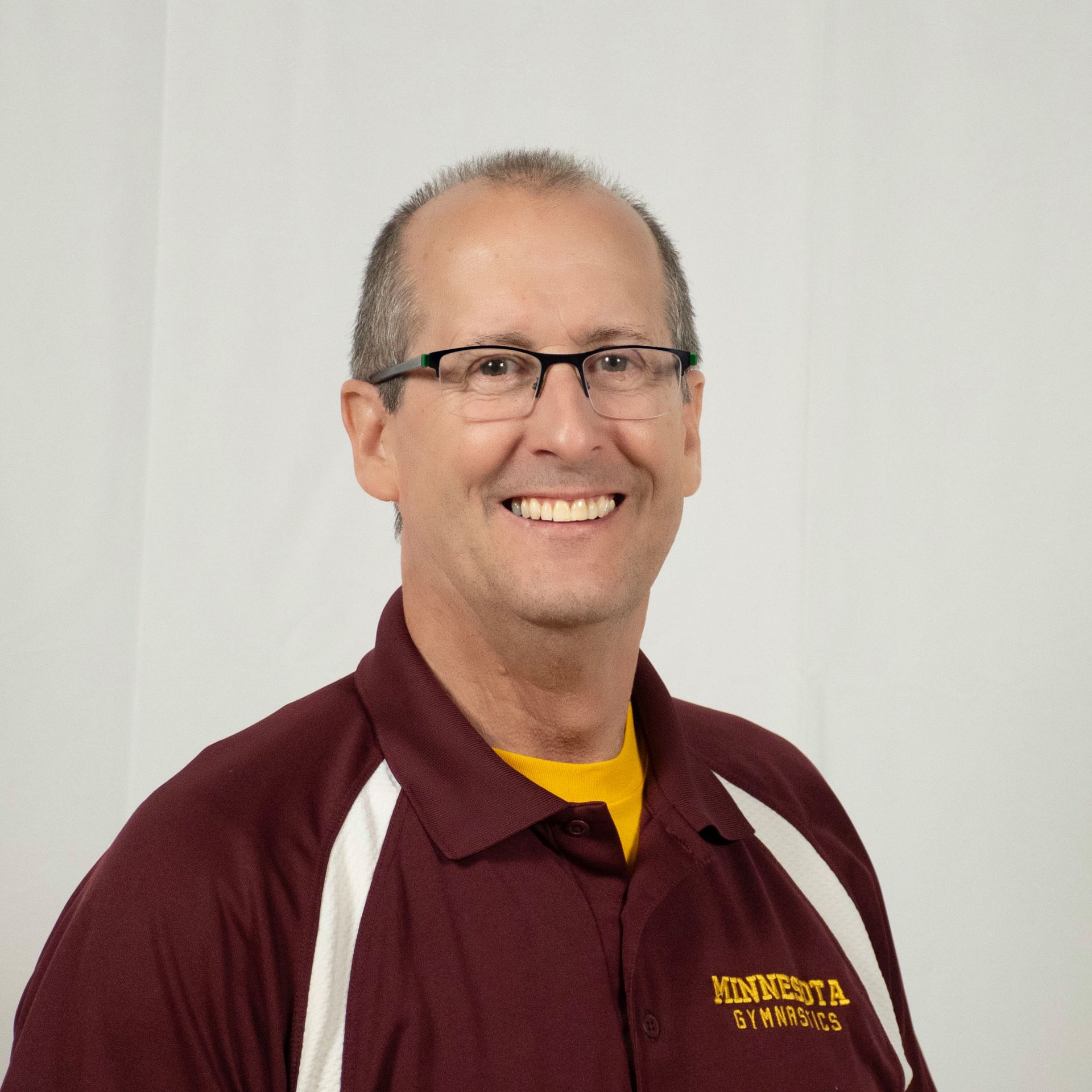 Man in maroon shirt with