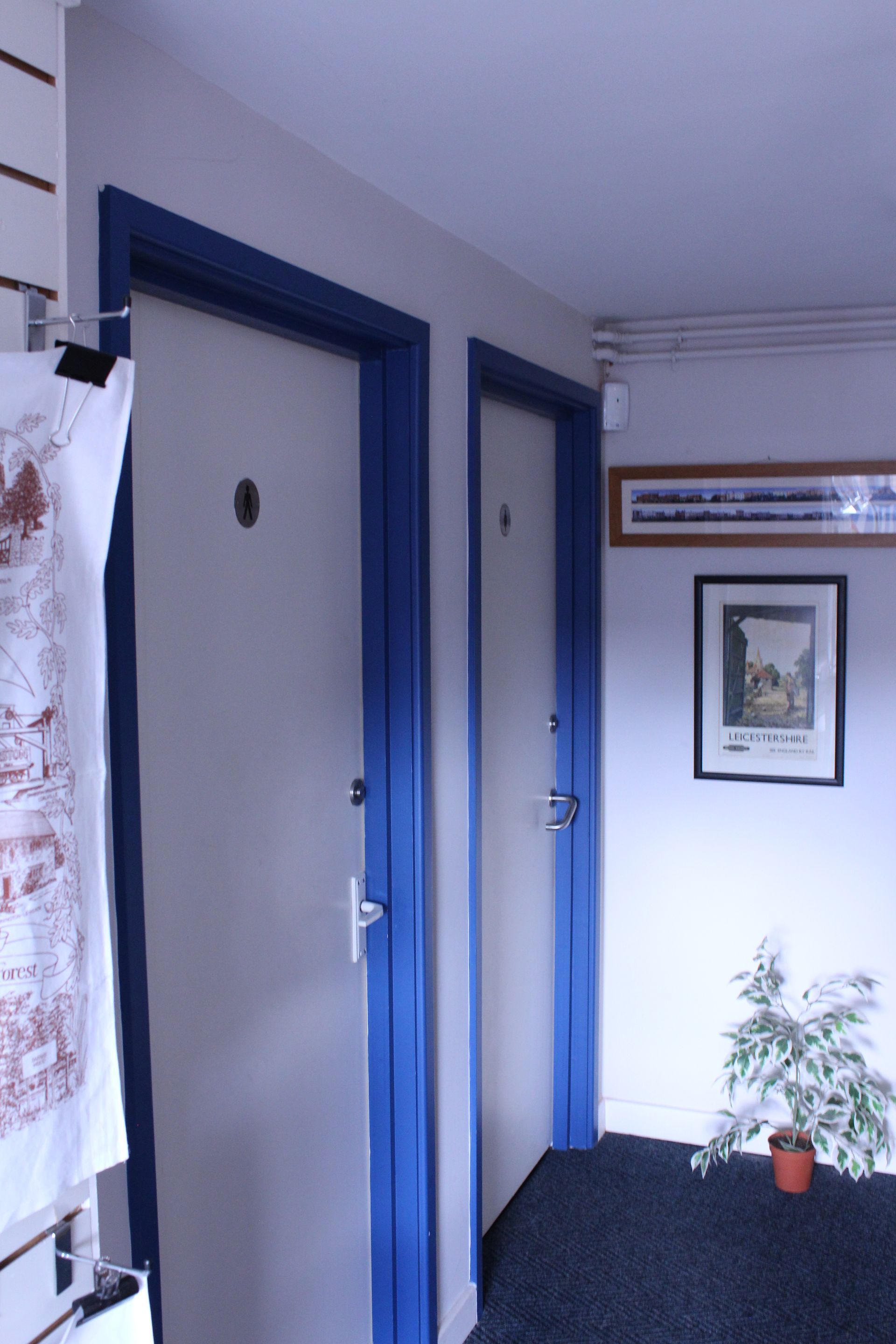Two pictures of a hallway and a bathroom with a toilet