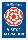 A blue sign that says visitengland visitor attraction
