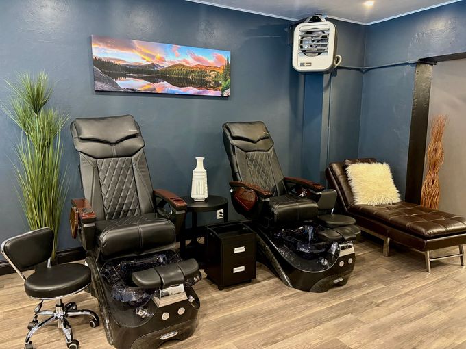 A room with three chairs and a couch in it.