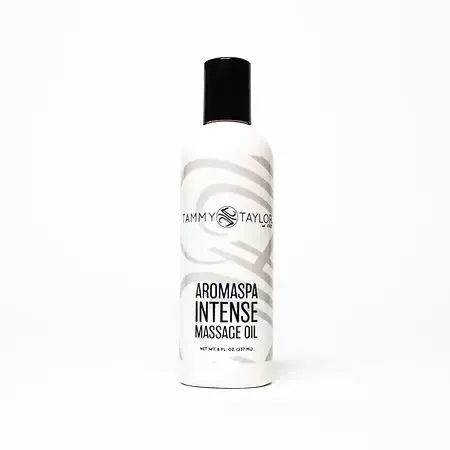 A bottle of aromaspa intense massage oil on a white background.