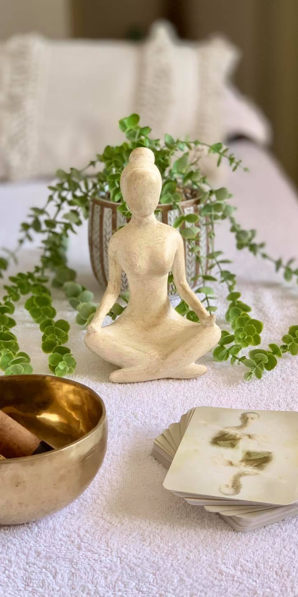 meditation statue and a plant
