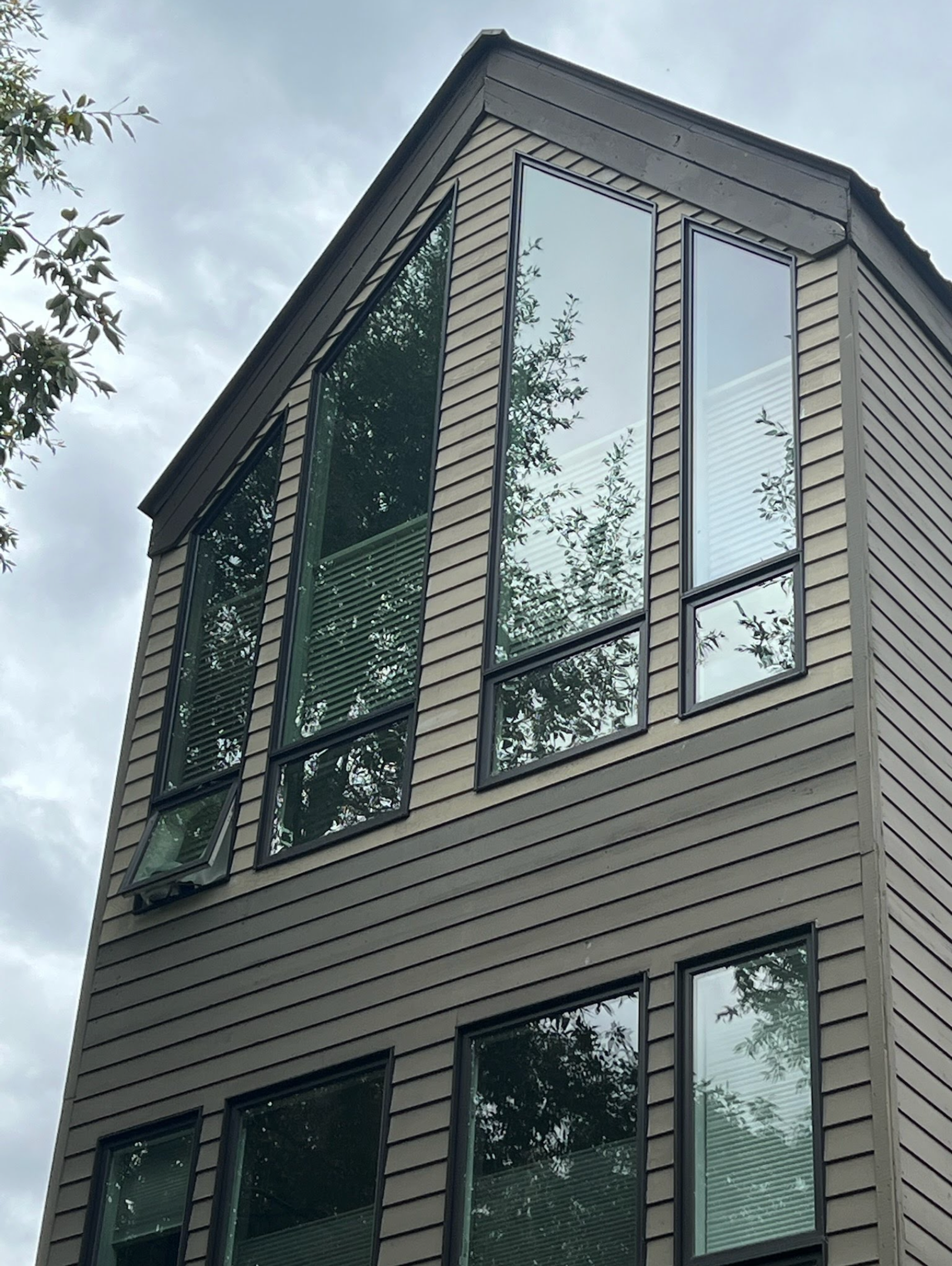 a large building with a lot of windows installed by Sun Glass Cortez