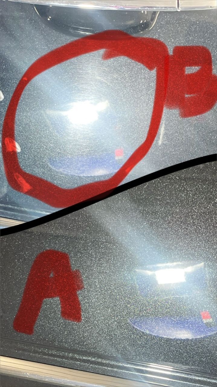 A close up of a car door with a red circle around the letter a.