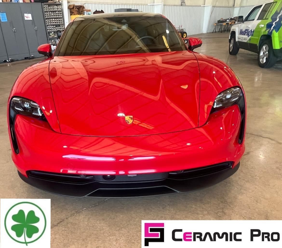 A red sports car with ceramic pro written on the bottom