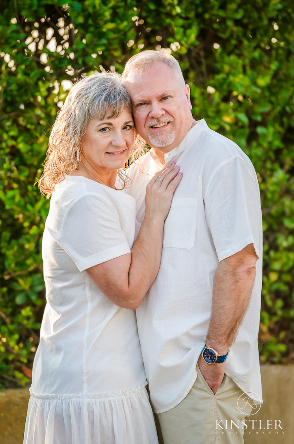 A man and a woman are posing for a picture together.