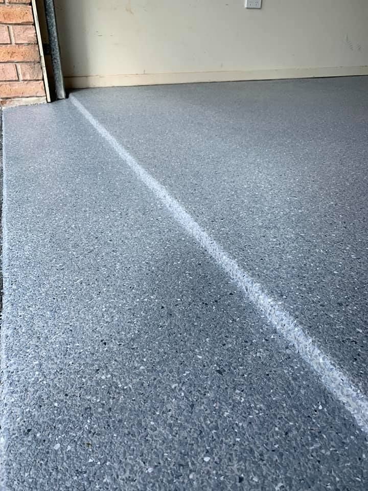 A Close Up Of A Gray Concrete Floor In A Garage — Partlic Painting & Epoxy Flooring In Taree, NSW