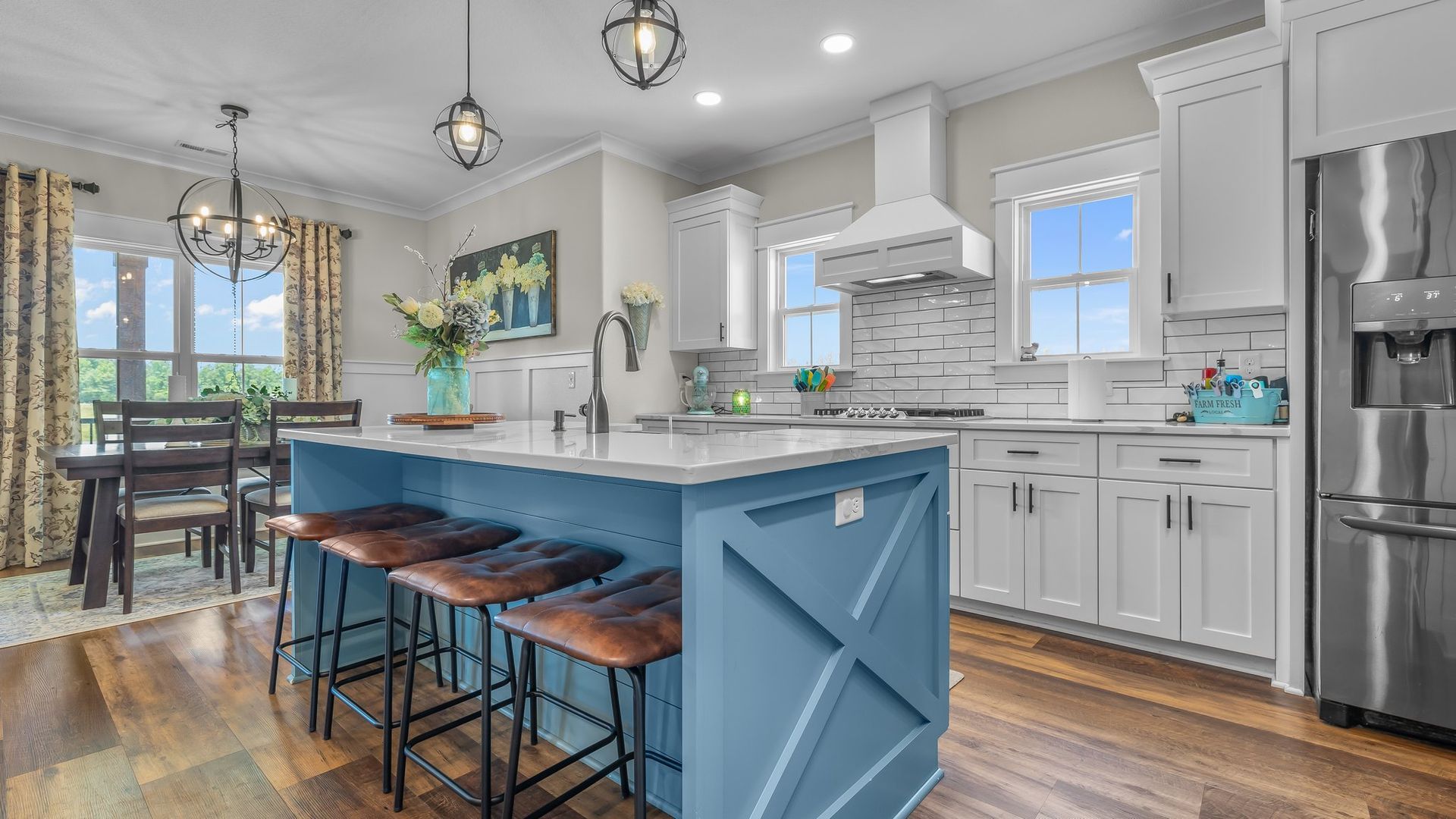A kitchen with a large island in the middle of it.