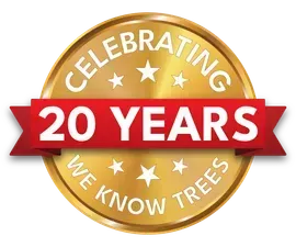 Gold anniversary badge reading “Celebrating 20 Years We Know Trees” with a red “20 YEARS” banner