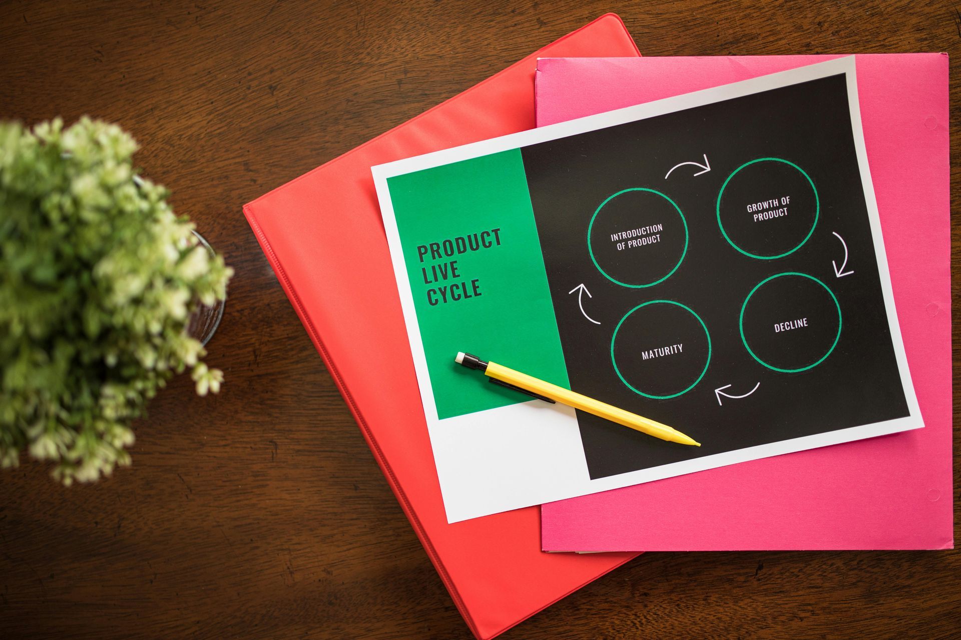 A pencil is sitting on top of a piece of paper with circles on it.