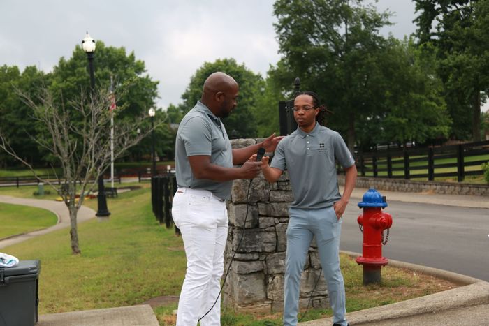 Mentee Kamari and TLN co-founder Erwin Raphael during the 1st Juneteenth Golf Tournament