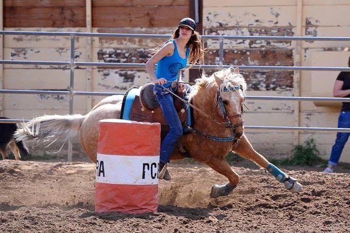 Rider and horse executing a turn at a barrel racing event, perfect for enthusiasts searching for barrel racing events near me.