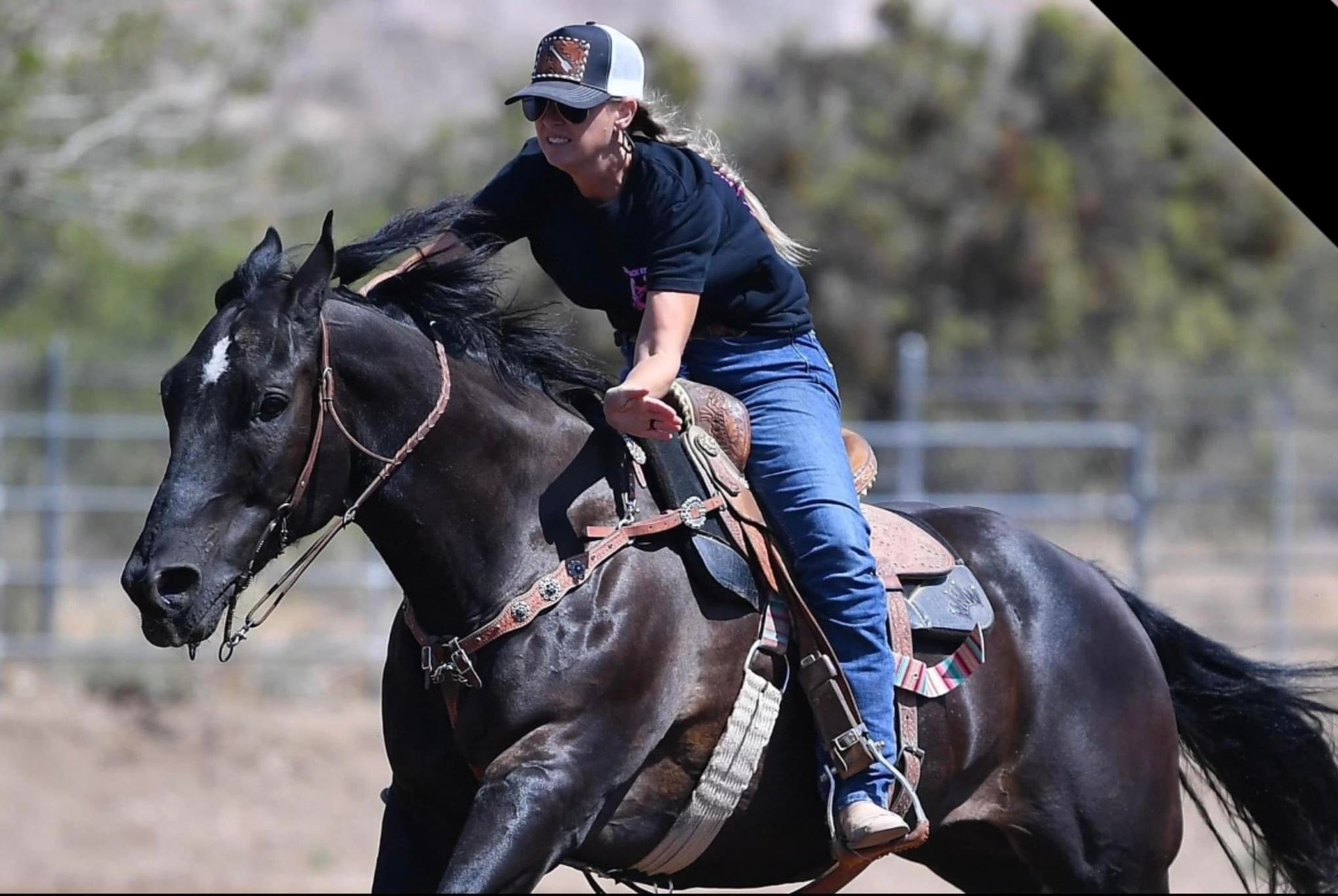 Barrel racer competes in a barrel racing event, turning sharply around a barrel in a sandy arena, exemplifying local barrel racing enthusiasm.