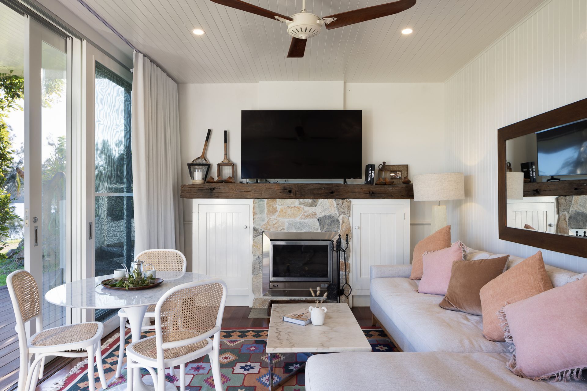 A living room with a couch and a flat screen tv
