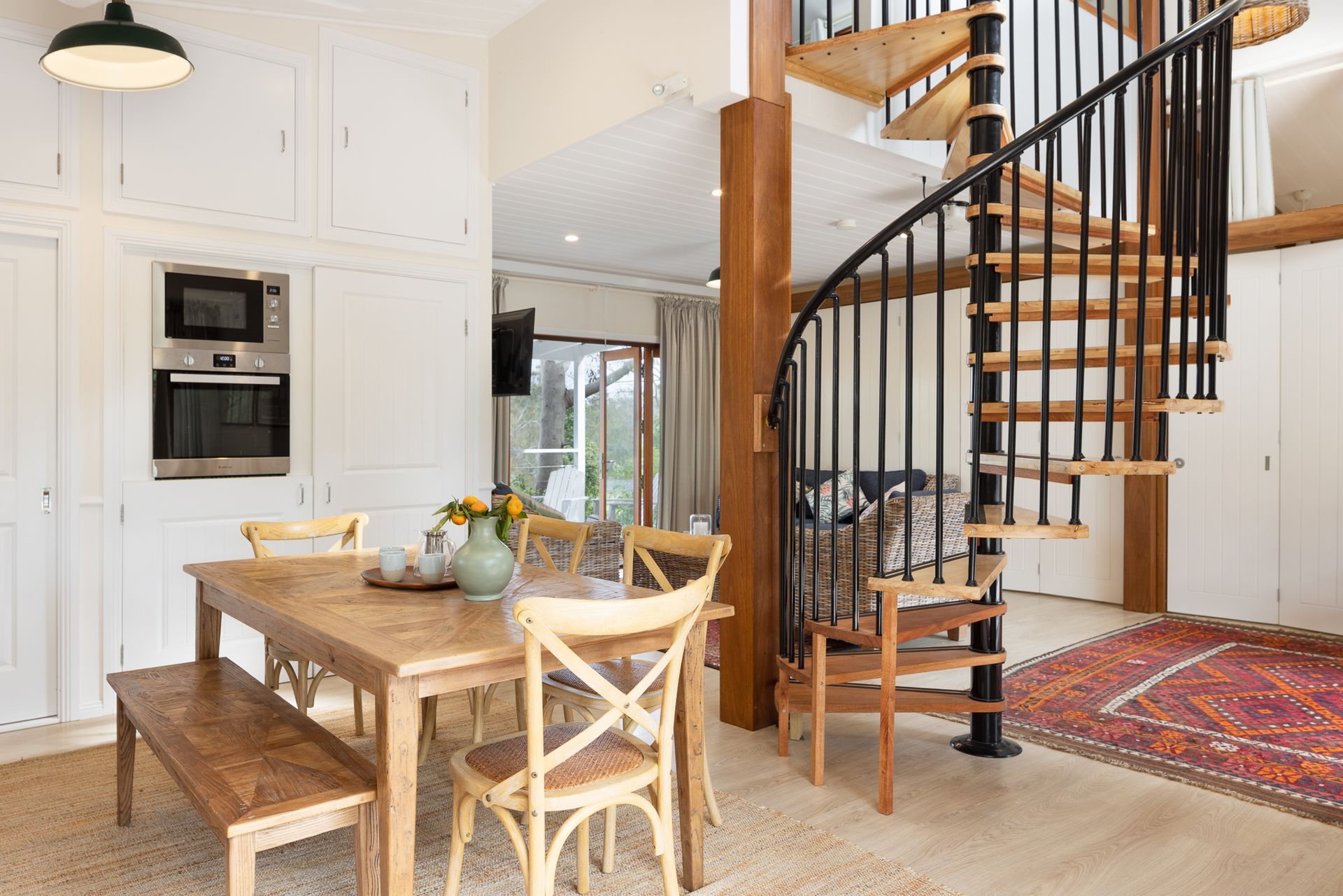 There is a spiral staircase in the middle of the room.