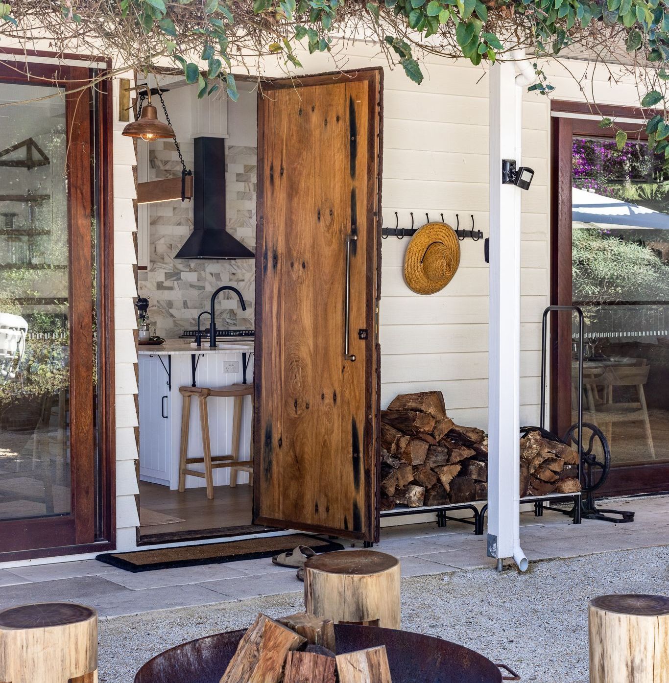 A kitchen with a fire pit in front of it