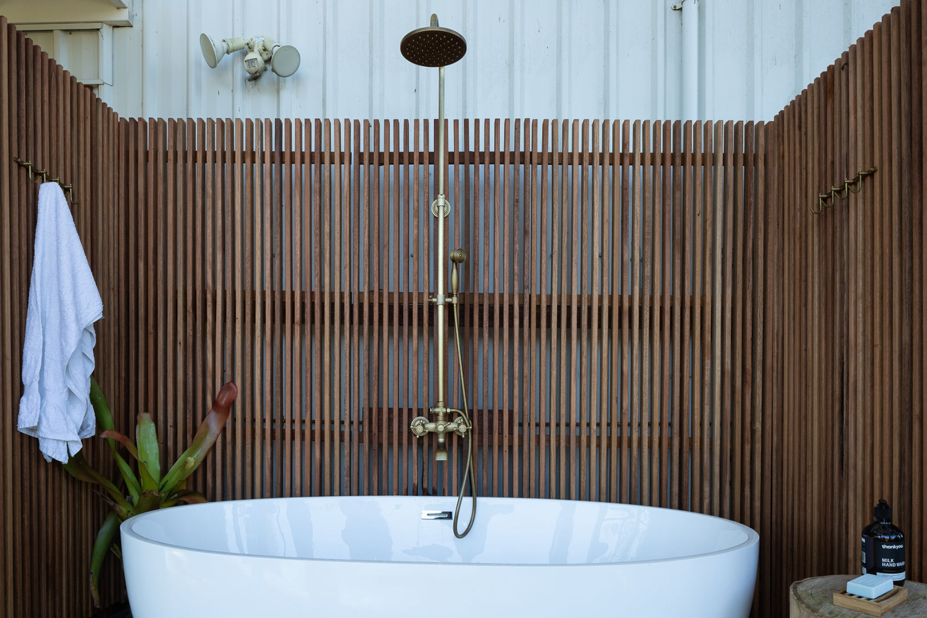 A bathroom with a bathtub and a shower.