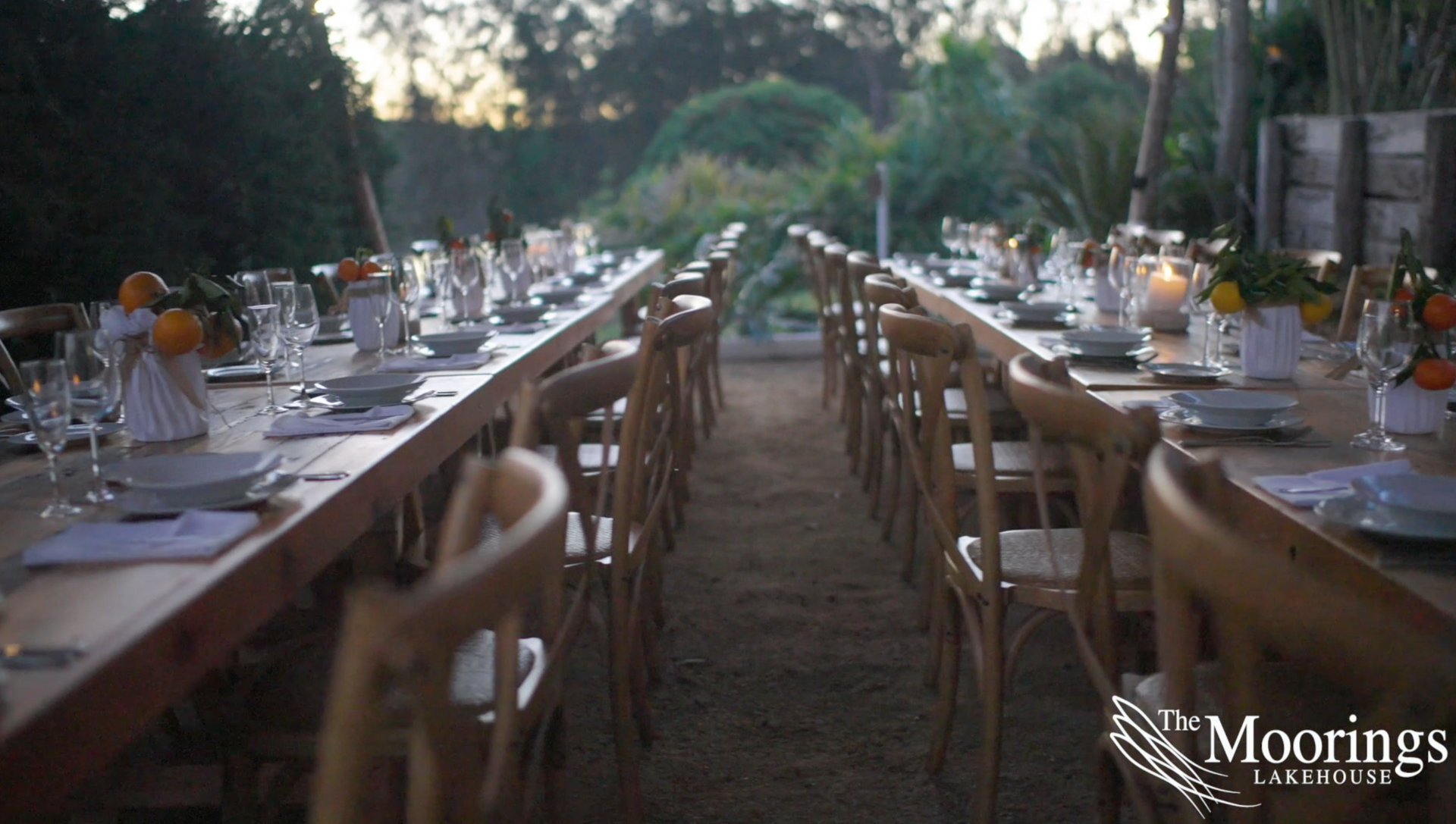 A long table with a lot of plates and glasses on it