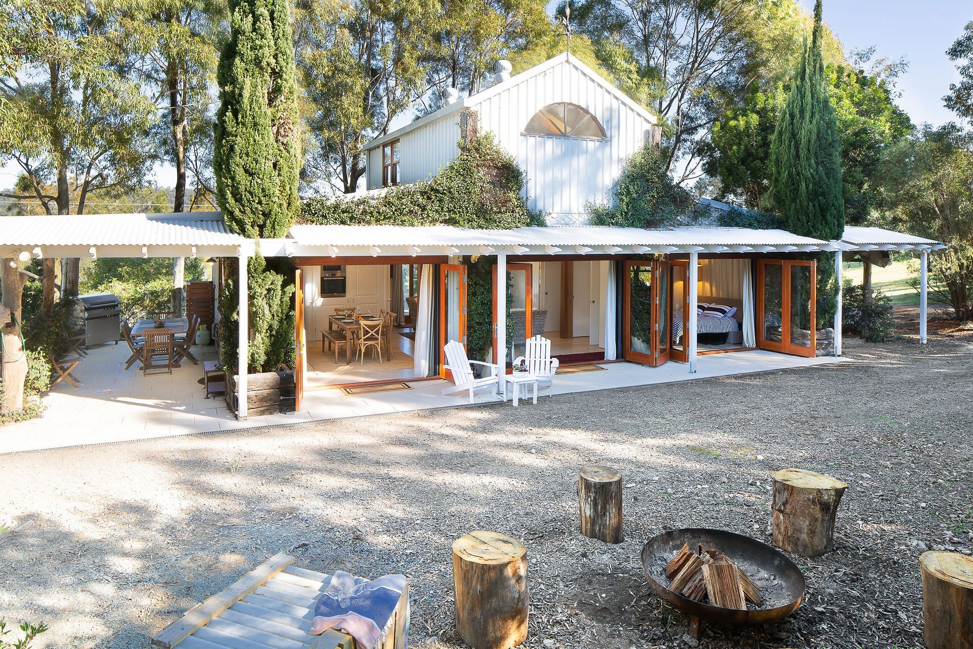 A house with a fire pit in front of it