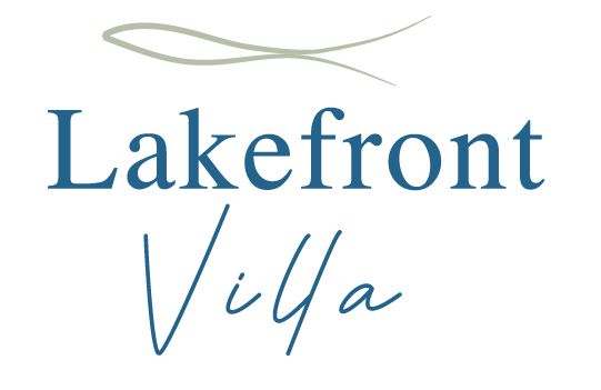 A logo for lakefront villa with a fish on it