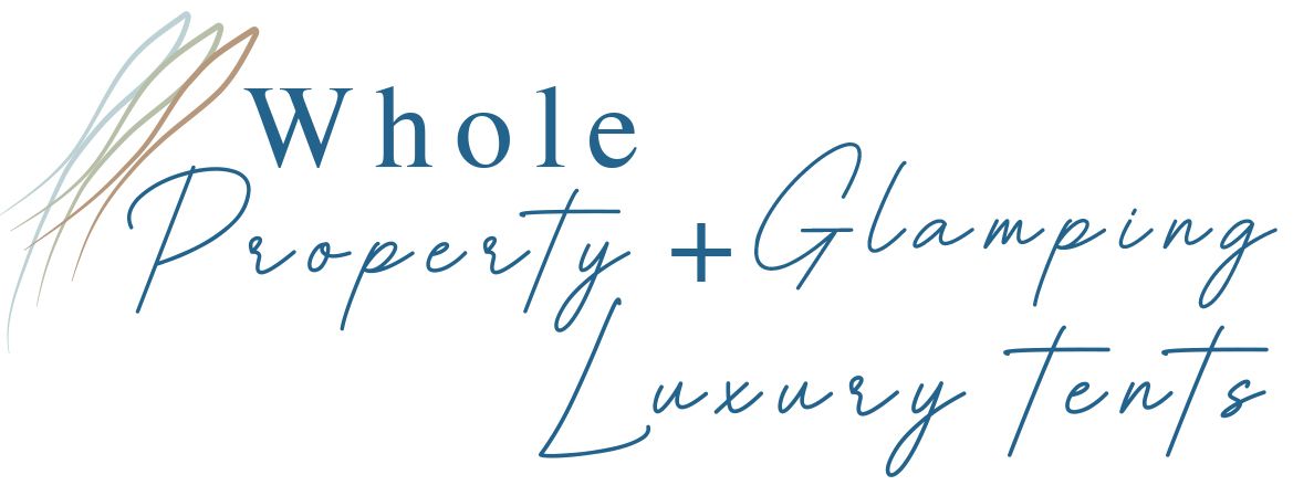 A logo for a company called whole property + glamping luxury tents.