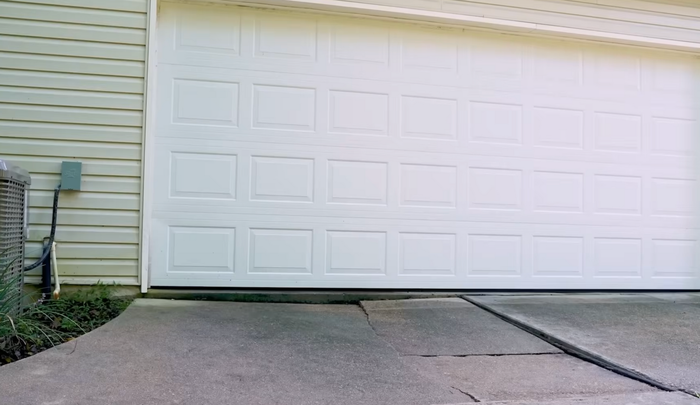 Before image of a driveway in need of concrete lifting and leveling in fort worth TX