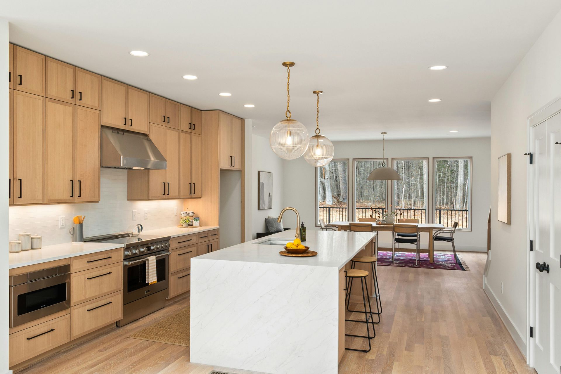 Custom home in State College, PA. Amish builder. Kitchen with waterfall island, custom cabinets