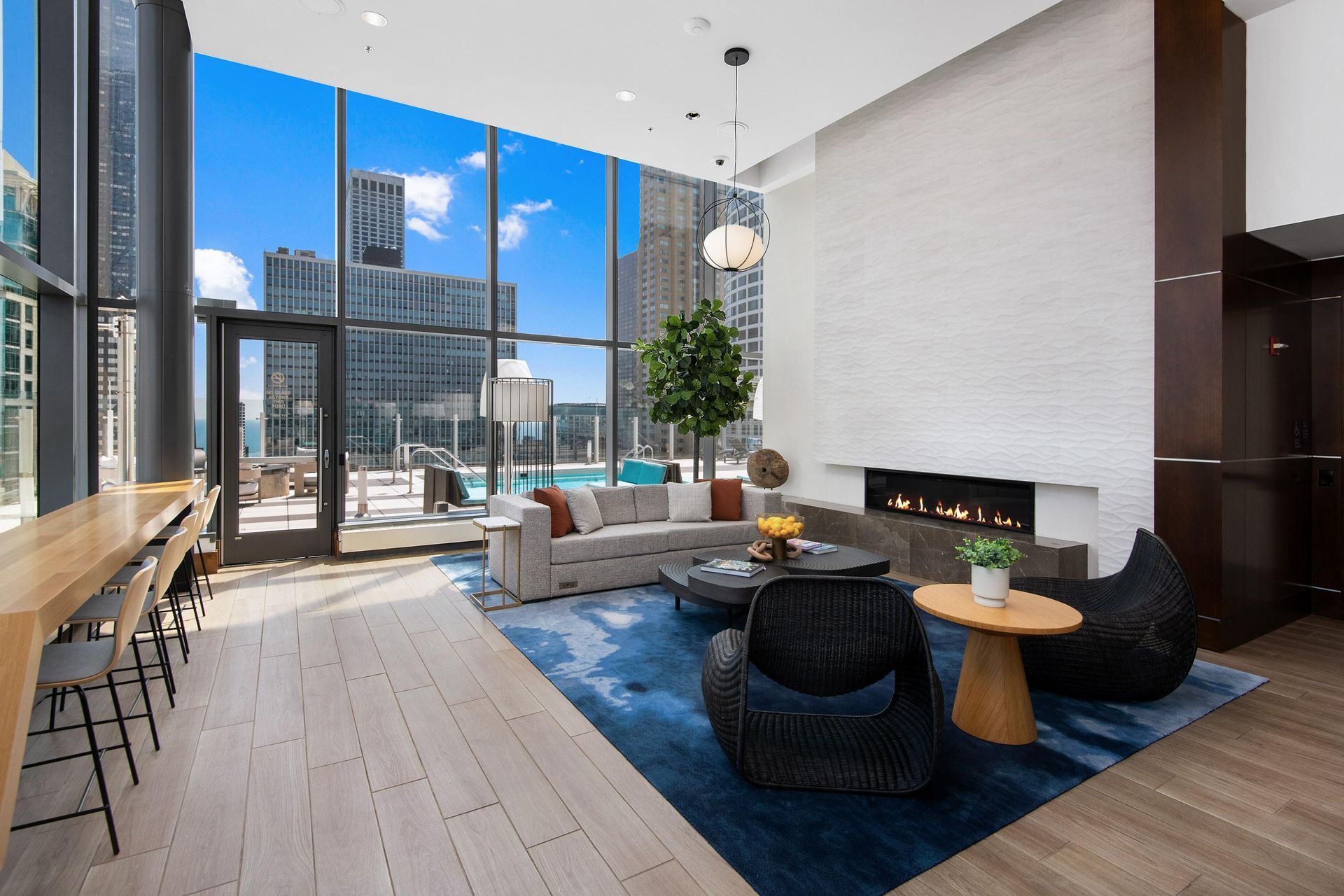 a living room with a couch and a table in front of a fireplace