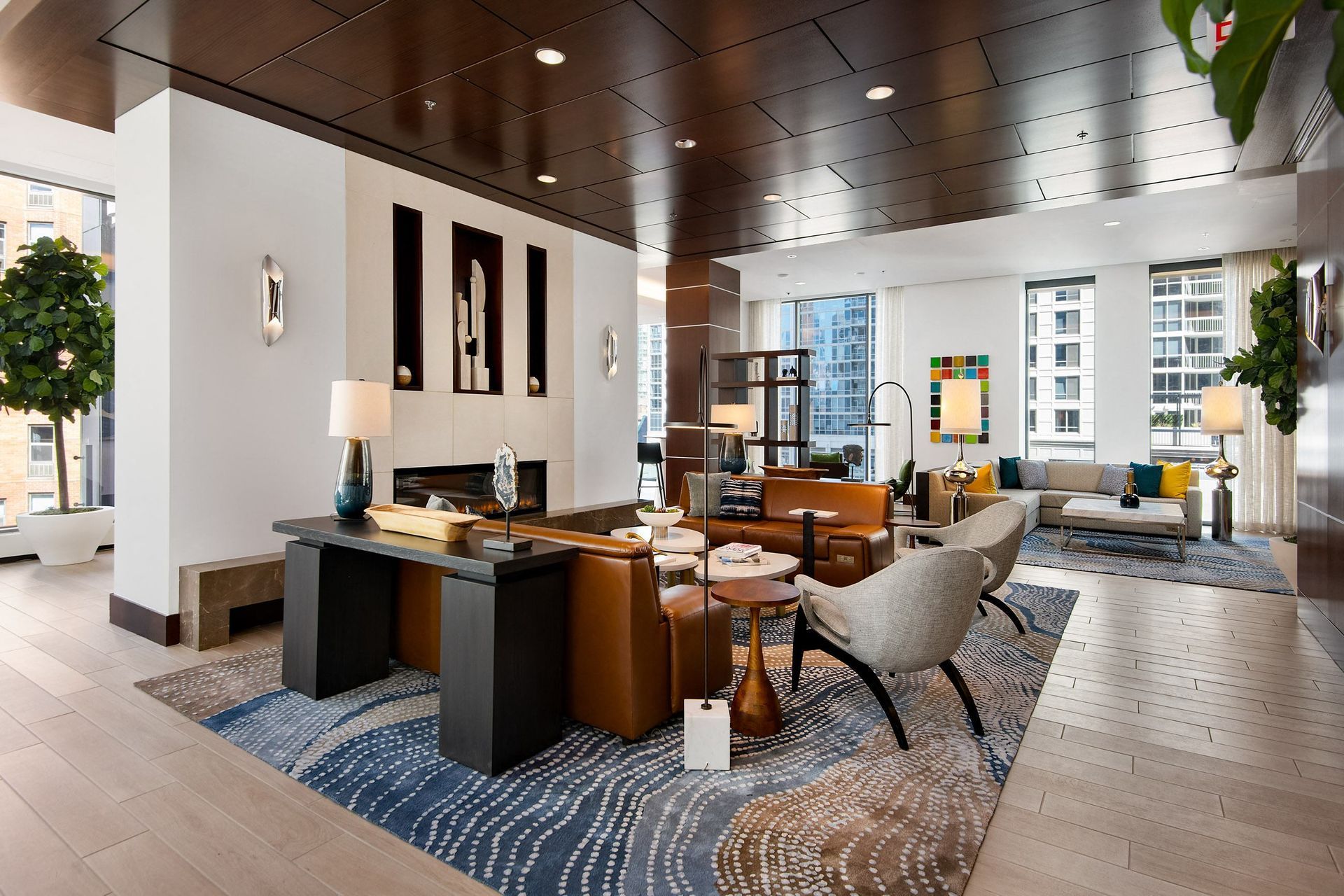 the lobby of a hotel with a reception desk and a living room