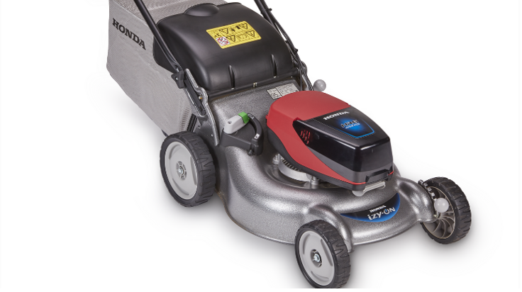 A honda lawn mower is sitting on a white surface — Terrace Mowers in Raymond Terrace, NSW