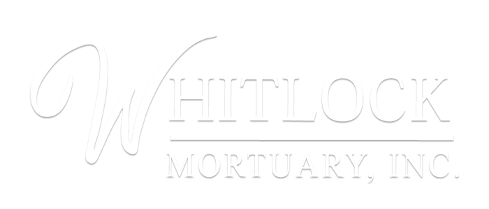 Whitlock Mortuary, Inc. logo in white serif text on a light background
