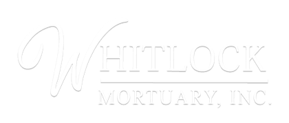 Whitlock Mortuary, Inc. logo in white serif text on a light background