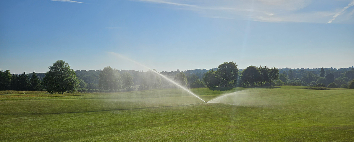 752 sprinkler running on a fairway golf sprinkler running