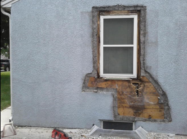 “Damaged stucco around a window with exposed repair areas before patching during a stucco service in Spring Valley, NV”