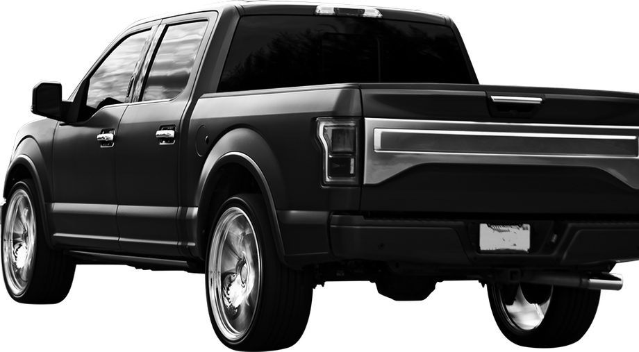 Black pickup truck, rear view, chrome wheels, tinted windows  | Freestate Auto & Truck Service