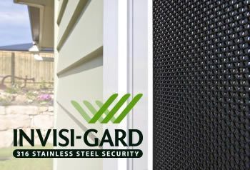 INVISI-GARD 316 stainless steel security screen on a sliding door beside a window