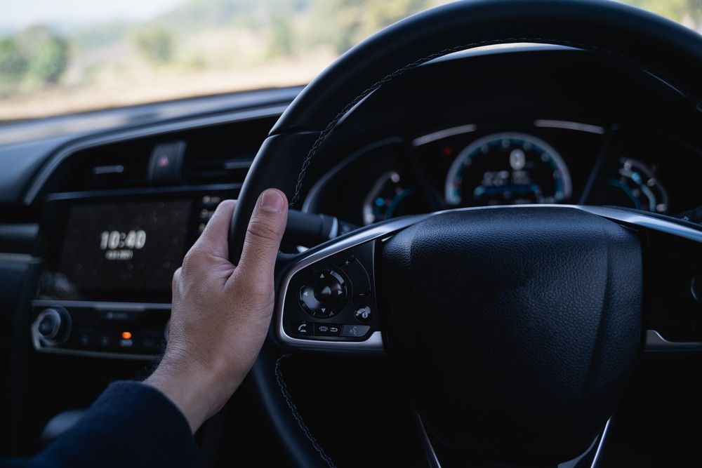 A Person is Holding the Steering Wheel of a Car — Raff's Advanced Automotive P/L in Fairy Meadow, NSW