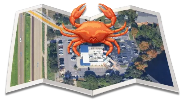 A map with a crab on top. The map shows a building with parking and a road.