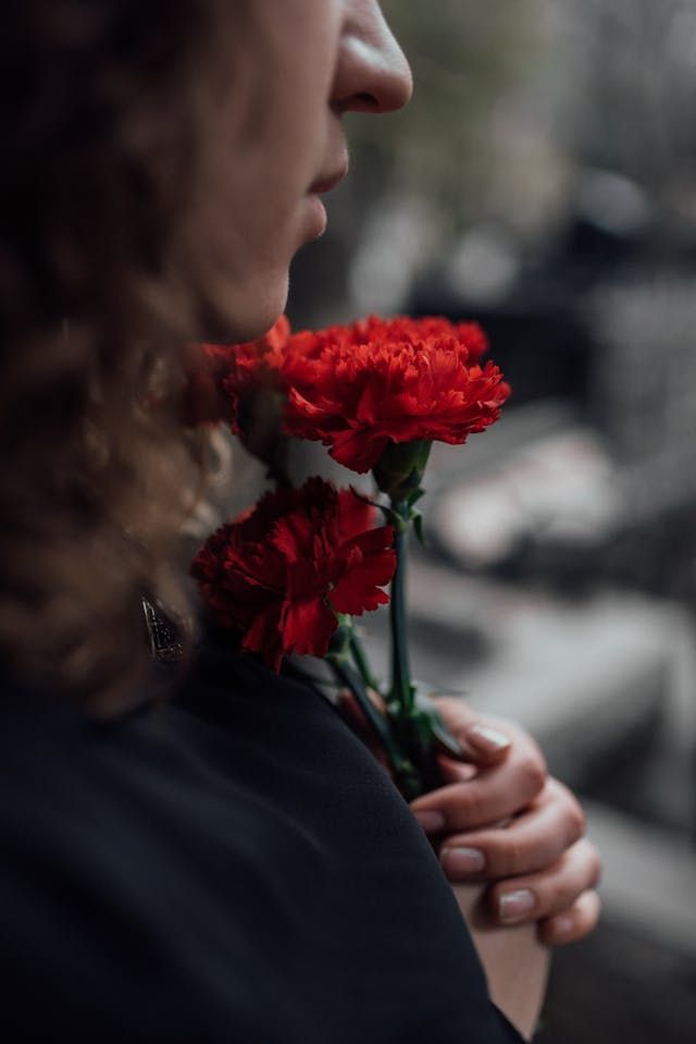 A young lady grieving from the loss of a loved one