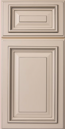 Beige raised panel cabinet door with ornate trim.