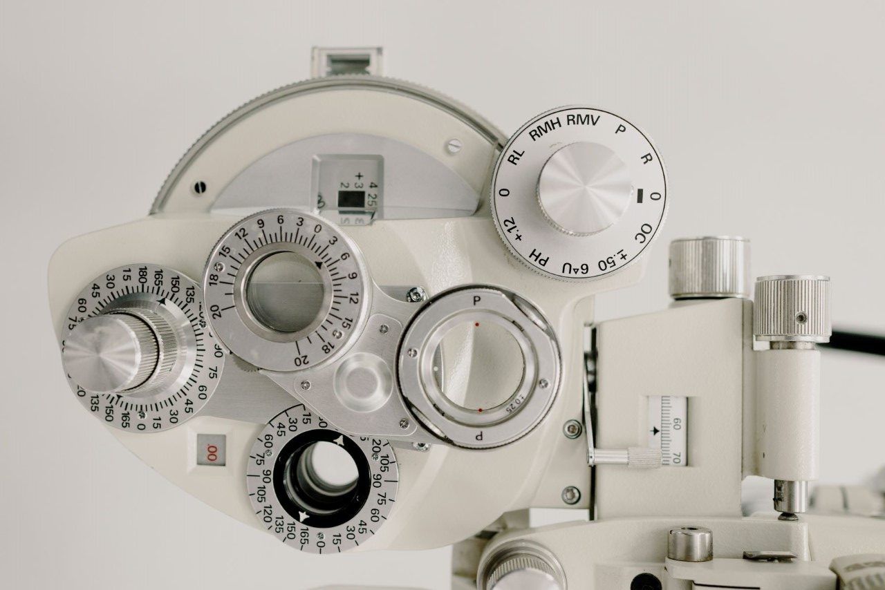 A close up of a machine with a lot of buttons and knobs on it.