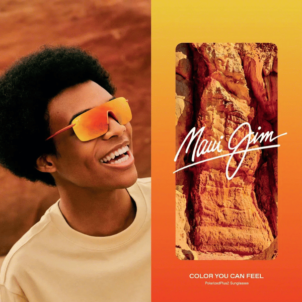 A man wearing sunglasses next to a maui jim advertisement