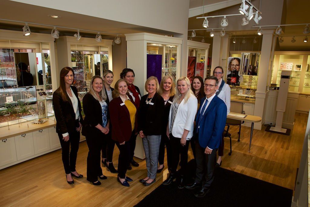 A group of people are posing for a picture in a store.