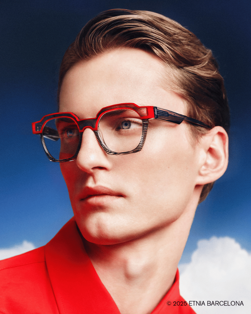 A man wearing red glasses and a red shirt