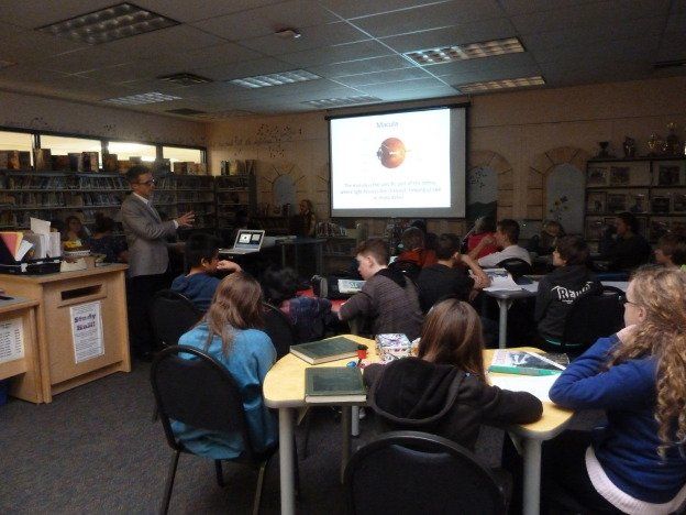 A man is giving a presentation to a group of people