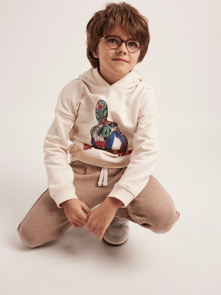 A boy is wearing glasses
