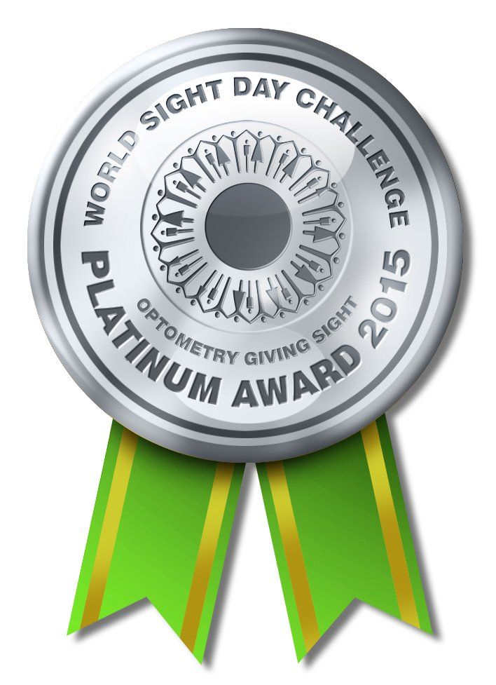 A silver medal with a green ribbon that says world sight day challenge platinum award 2015