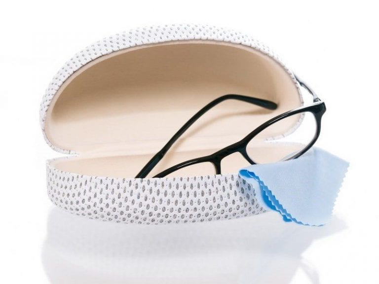 A pair of glasses in a case with a cloth