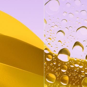 A close up of water drops on a lens.
